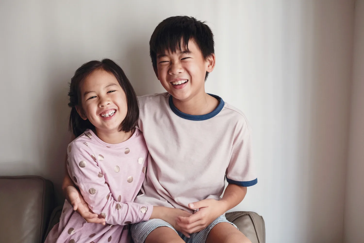 A child and parent together in soft natural light