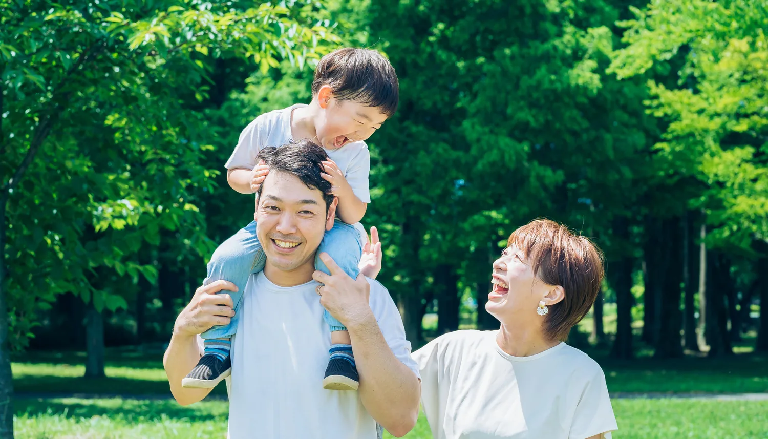 A parent and child side by side outdoors
